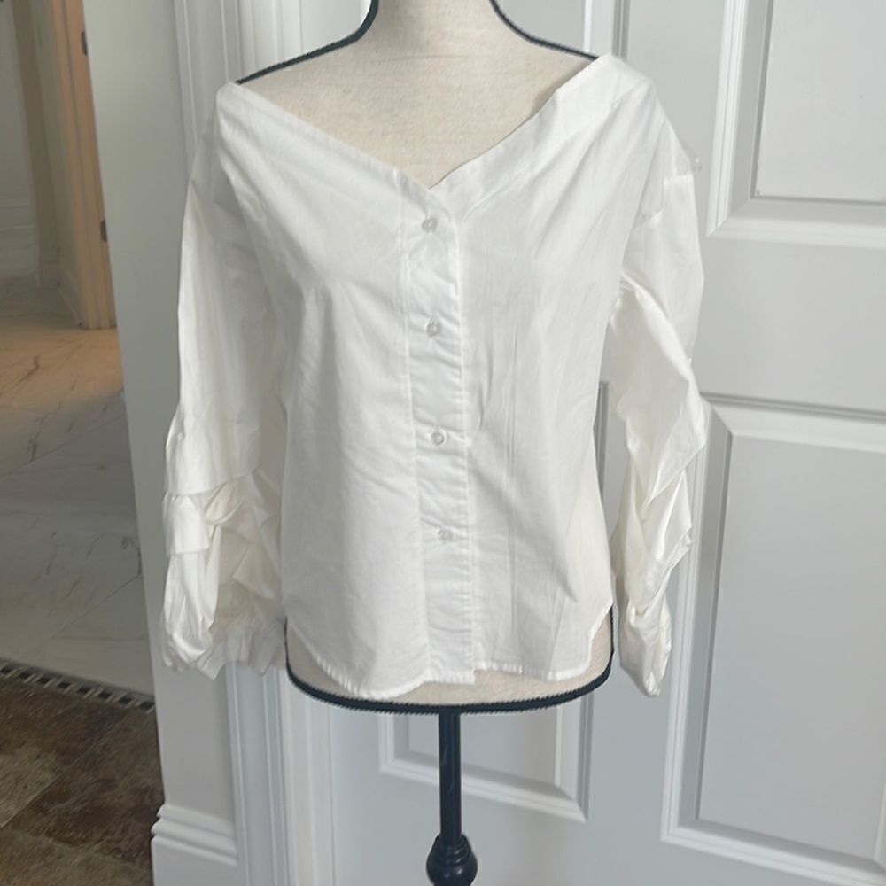 Adorable off shoulder White blouse with pleated puff sleeves.